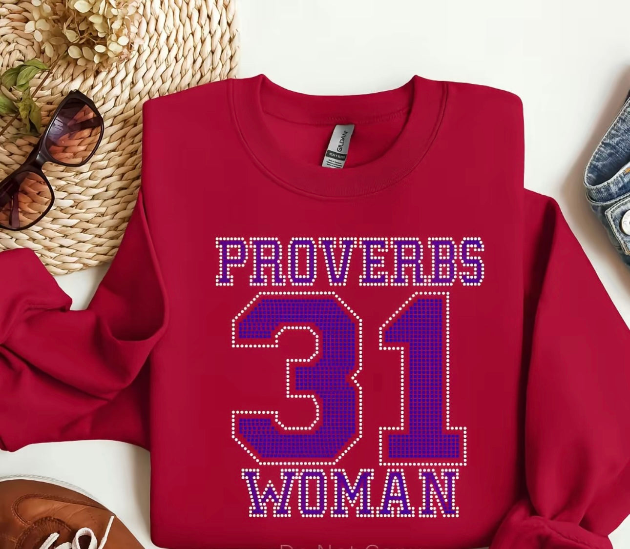 Red sweatshirt with 'Proverbs 31 Woman' text on a white background